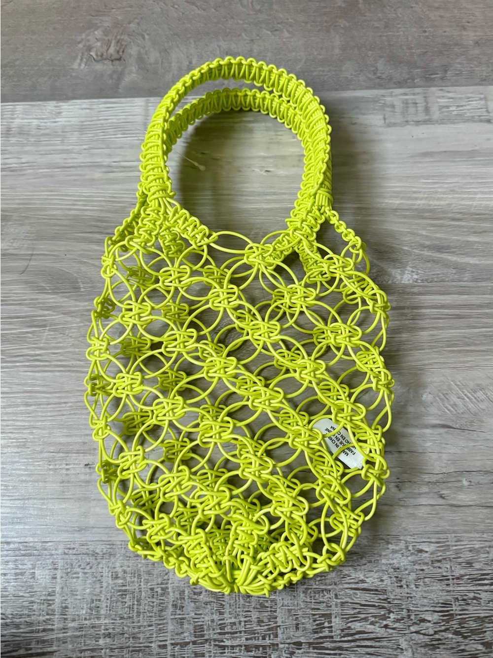 Urban Outfitters — a charming boho-style bag featuring an open-weave design. A c